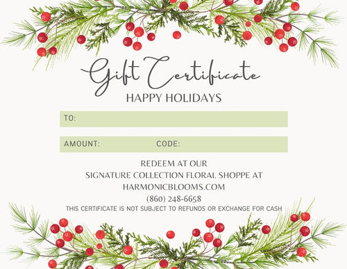 A festive holiday gift certificate template with watercolor pine branches and red berries at the top and bottom, on a light cream background. The certificate includes fields for 'TO:', 'AMOUNT:', and 'CODE:' and reads 'HAPPY HOLIDAYS' with store details for Harmonic Blooms in Glastonbury, CT.